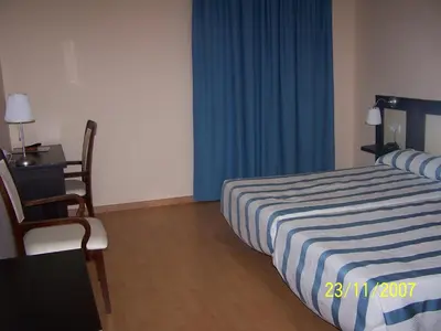 Cama o camas de una habitación en Hotel Castillo