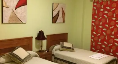 Cama o camas de una habitación en Hostal el mirador