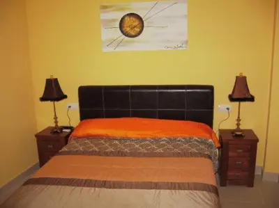 Cama o camas de una habitación en Hostal el mirador