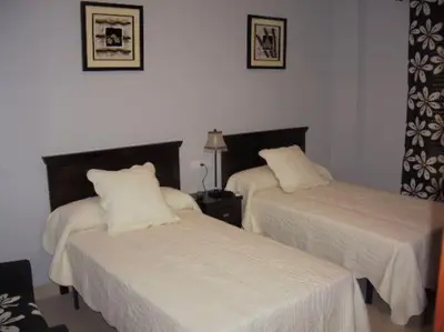 Cama o camas de una habitación en Hostal el mirador