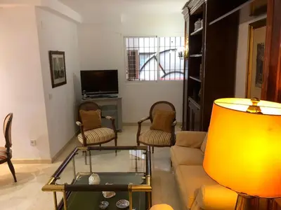 Una televisión o centro de entretenimiento en Alojamiento Ronda de los Tejares