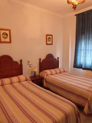 Cama o camas de una habitación en Hostal Restaurante Las Canteras