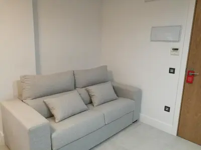 Zona de estar de Apartamentos Las Palmeras