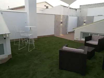 Zona de estar de Apartamentos Las Palmeras