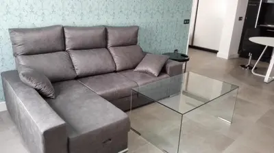 Zona de estar de Apartamentos Las Palmeras