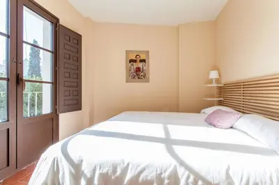 Cama o camas de una habitación en Apartamentos RG Conde de Ibarra con GARAJE