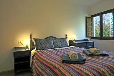 Cama o camas de una habitación en La Panadería at Molino la Ratonera