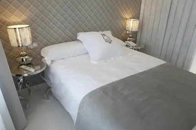 Cama o camas de una habitación en La Casa del Médico Hotel Boutique