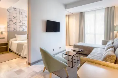 Cama o camas de una habitación en Hotel San Pablo Sevilla