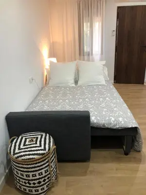 Cama o camas de una habitación en Estudio a 400 metros Ribera FREE PARKING