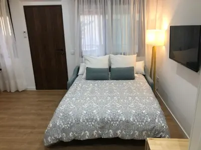 Cama o camas de una habitación en Estudio a 400 metros Ribera FREE PARKING