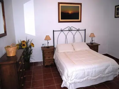 Cama o camas de una habitación en Rustic Retreat in Andalusia