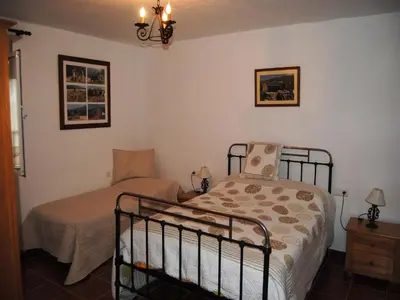 Cama o camas de una habitación en Rustic Retreat in Andalusia