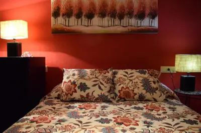 Cama o camas de una habitación en Apartamento frente a Palacio de Congresos (Fibes)