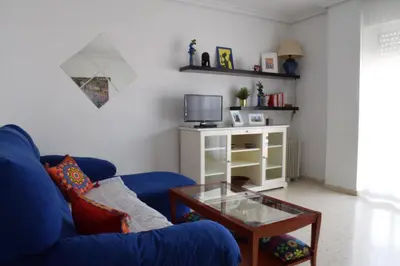 Una televisión o centro de entretenimiento en Apartamento frente a Palacio de Congresos (Fibes)