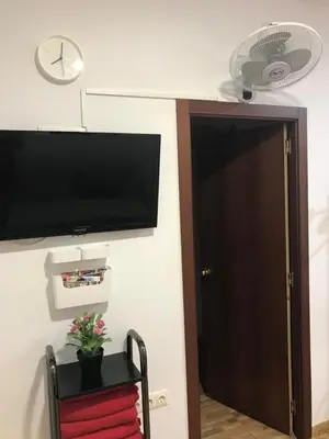 Una televisión o centro de entretenimiento en CASA SUR APARCAMIENTO GRATIS