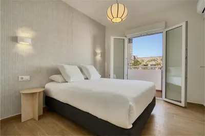 Cama o camas de una habitación en SUNN Amador de los Ríos, by Homing U