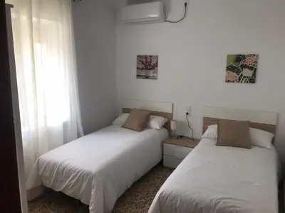 Cama o camas de una habitación en Casa patio ribera de córdoba