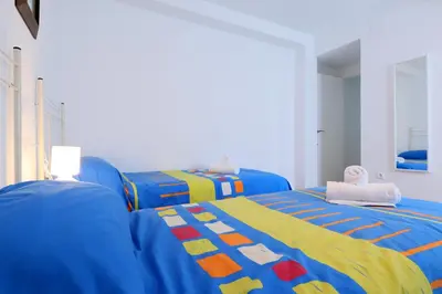 Cama o camas de una habitación en Rosas en la Balconada & Apartment with Parking in Córdoba Historic Center