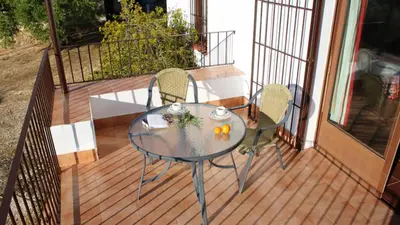 Un balcón o terraza de Charming house in Estepa with shared pool.