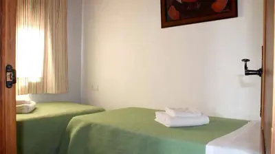 Cama o camas de una habitación en Charming house in Estepa with shared pool.