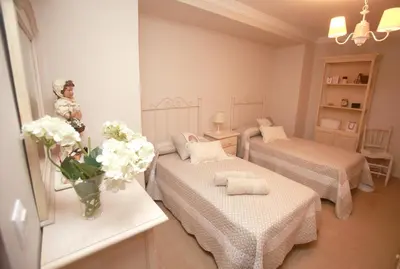 Cama o camas de una habitación en Dúplex-Ático de Nácar Casco Histórico