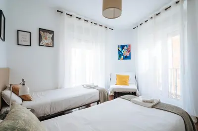 Cama o camas de una habitación en HomeySeville-Lovely Duplex at Santa Cruz 10 pax, Parking Optional