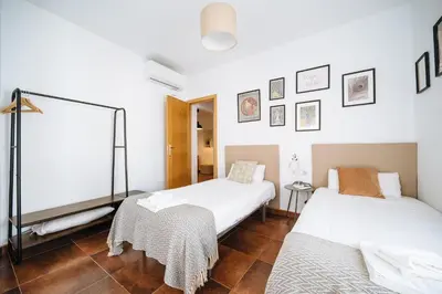 Cama o camas de una habitación en HomeySeville-Lovely Duplex at Santa Cruz 10 pax, Parking Optional