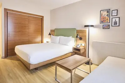 Cama o camas de una habitación en Hilton Garden Inn Sevilla