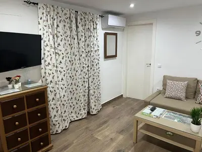 Una televisión o centro de entretenimiento en Apartamento de Lola