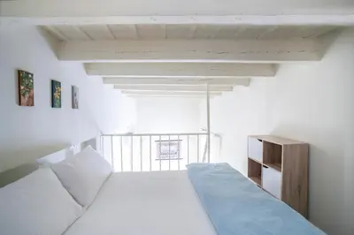 Cama o camas de una habitación en Alohamundi Alameda