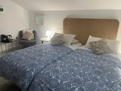 Cama o camas de una habitación en El nido del Chorro