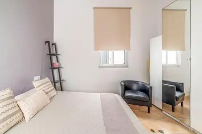 Cama o camas de una habitación en APARTAMENTO PASAJE VALVANERA