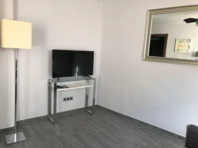 Una televisión o centro de entretenimiento en Apartamento Girasol