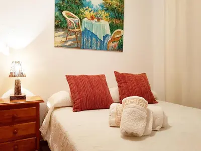 Cama o camas de una habitación en Apartamento turístico en Sevilla