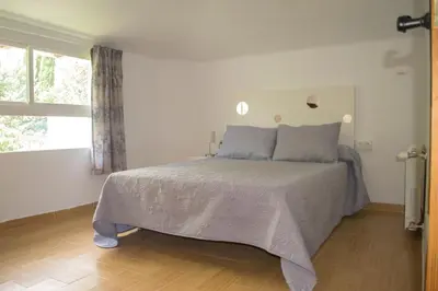 Cama o camas de una habitación en Hostal Caseria San José de Hutar
