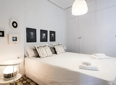 Cama o camas de una habitación en Alhóndiga Suite Apartment with Terrace