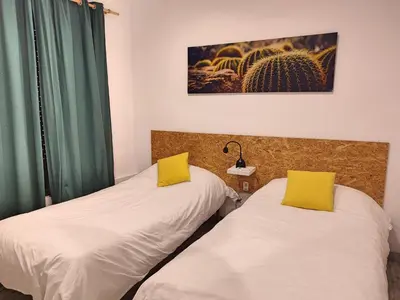 Cama o camas de una habitación en La Casa de Pedro Verdugo Apartamento Turístico