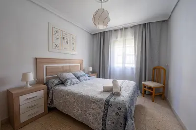 Cama o camas de una habitación en Sevilla Sol