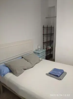 Cama o camas de una habitación en Vivienda Turística Templo Romano