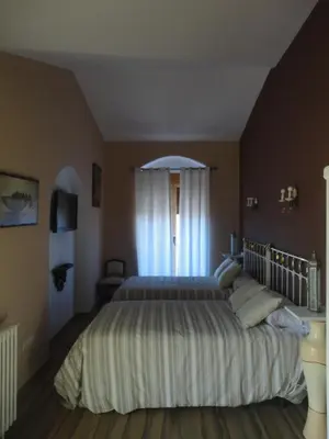 Cama o camas de una habitación en Hotel Rural las Cinco Ranas