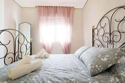 Cama o camas de una habitación en Duque de Hornachuelos, parking en pleno centro