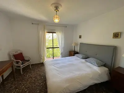 Cama o camas de una habitación en Casa El Chorro con magníficas vistas