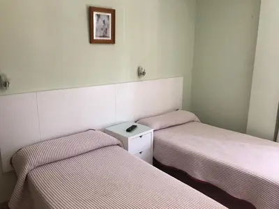 Cama o camas de una habitación en Hostal Rio de Oro