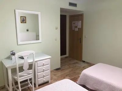 Cama o camas de una habitación en Hostal Rio de Oro