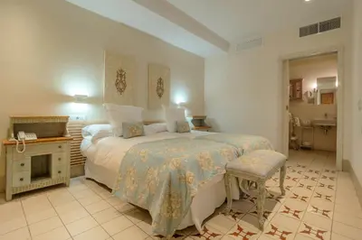 Cama o camas de una habitación en ApartaSuites Alberca Deluxe