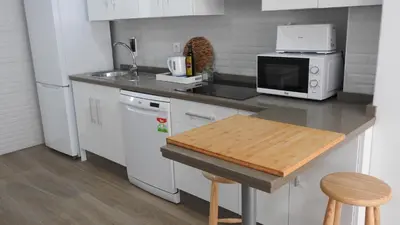 Una cocina o zona de cocina en Viviendas con Fines Turisticos ``La Jamuga´´