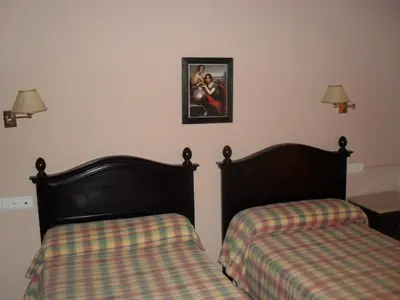 Cama o camas de una habitación en Hostal San Luis