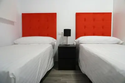 Cama o camas de una habitación en Apartamentos Ondeanos