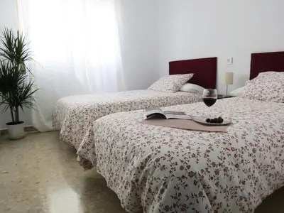 Cama o camas de una habitación en Patios de San Rafael
